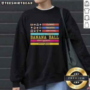 Alt Text: Good Savannah Bananas sweatshirt featuring clowns, tailgaters, firefighters, and American flag design.