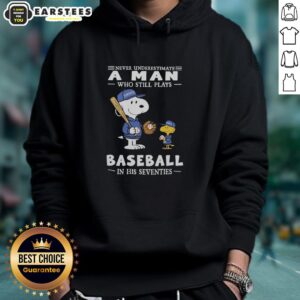 Alt Text: Cute Peanuts x Toronto Blue Jays hoodie featuring Never Underestimate A Man Who Still Plays Baseball In His Seventies.