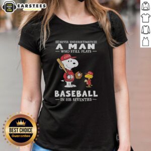 Alt Text: Cute Peanuts X St. Louis Cardinals tee for ladies: 'Never Underestimate A Man Who Still Plays Baseball In His Seventies'