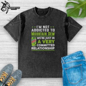 Funny 'I'm Not Addicted to Mountain Dew' washed t-shirt featuring a vibrant green design and relaxed fit.