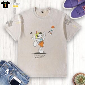 Alt Text: Disney Mickey Mouse washed t-shirt featuring 'Pretty Someday I'll Be A Real Boy' design in vibrant colors.