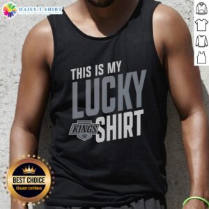 Alt Text: Fan wearing a lucky tank top supporting the Los Angeles Kings at a game, showcasing team pride and spirit.