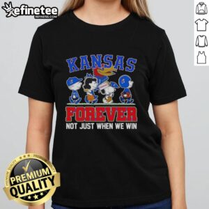 Cartoon characters on a ladies tee featuring 'Top Peanuts X Kansas Jayhawks Forever Fan' design, perfect for loyal fans.