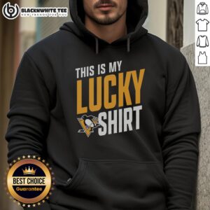 Fan wearing a lucky Pittsburgh Penguins hoodie, showing team spirit and excitement for hockey season.