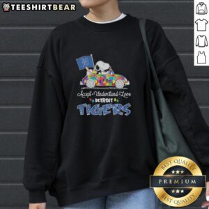 Pretty Snoopy and Woodstock driving a car on a Detroit Tigers sweatshirt promoting autism acceptance and love.