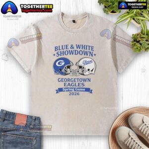 Alt Text: Awesome blue and white Georgetown Eagles spring game 2026 washed t-shirt displayed on a wooden background.