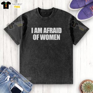 Funny 'I Am Afraid of Women' washed t-shirt displayed on a hanger, showcasing humor and casual style for men.