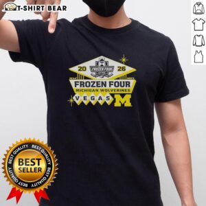 Official 2026 Men's Ice Hockey Frozen Four Bound Michigan Wolverines T-Shirt featuring team colors and logo.