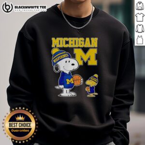 Alt Text: Snoopy and Woodstock wearing Michigan Wolverines jersey sweatshirt, showcasing team spirit and cute cartoon style.