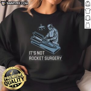 Funny 'It's Not Rocket Surgery' sweatshirt featuring playful text design for casual wear and humor lovers.