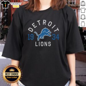 Official Detroit Lions Heritage Print Ladies Tee showcasing team spirit with stylish design, perfect for fans and casual wear.