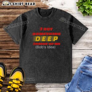 Alt Text: Casual washed t-shirt featuring 'Top I Got Something Deep Inside of Me' graphic design, perfect for laid-back style.