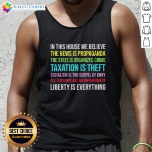 Alt Text: Libertarian version tank top featuring 'In This House We Believe' slogan, perfect for freedom-loving individuals.