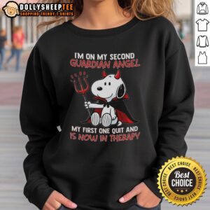 Funny Snoopy sweatshirt with 'I'm on my second guardian angel, my first one quit and is now in therapy' design.