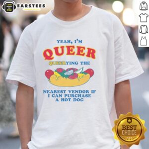 Person humorously asking a vendor about a hot dog T-shirt, showcasing pride with 'Yeah, I'm Queer' slogan.