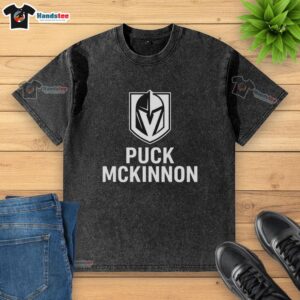 Premium Vegas Golden Knights ice hockey puck McKinnon logo on a washed t-shirt, perfect for fans and collectors.