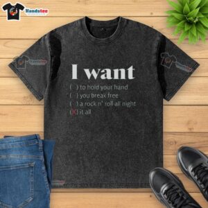 Alt Text: Good I Want It All Washed T-Shirt displayed on a hanger, featuring a trendy design and soft fabric.
