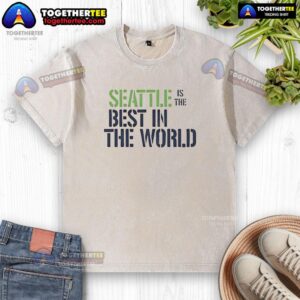 Awesome Seattle is the Best in the World ringer washed t-shirt displayed on a hanger against a colorful background.