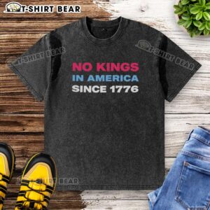 Jamie Lee Curtis wearing a retro washed t-shirt with 'No Kings In America Since 1776' graphic design.