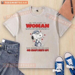 Funny Snoopy t-shirt featuring the quote 'Be the kind of woman that when your feet hit the floor' in vibrant colors.
