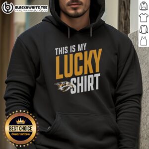 Person wearing a Nice Nashville Predators hoodie, showcasing team spirit and luck in a vibrant setting.