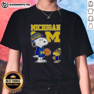 Alt Text: Snoopy and Woodstock in Michigan Wolverines jerseys on a ladies' tee, perfect for fans and stylish comfort.