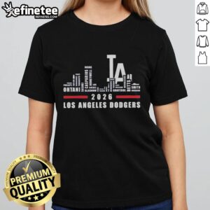 Los Angeles Dodgers 2026 greatest players graphic on a ladies tee with the LA city skyline in the background.