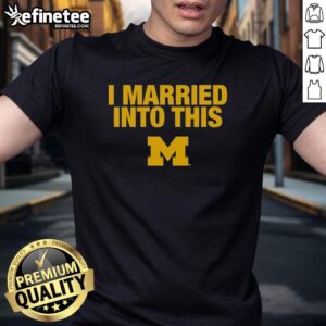 Alt Text: Official I Married Into This Michigan Wolverines T-Shirt featuring bold logo and vibrant colors for fans.
