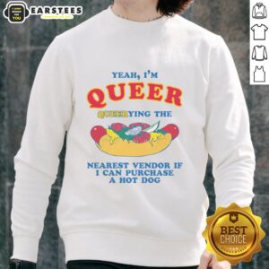 Alt Text: Person in a 'Funny Yeah I'm Queer' sweatshirt, humorously asking for a hot dog vendor nearby.