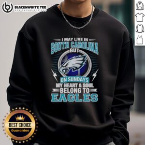 Cozy Philadelphia Eagles sweatshirt with text: 'I may live in South Carolina, but my heart belongs to the Eagles'.