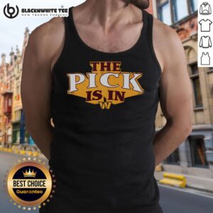 Top Washington Commanders pick wearing a tank top, showcasing team spirit and excitement during the NFL draft.