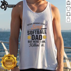 Hot Sexy Softball Dad wearing a stylish tank top, confidently showcasing his sporty look at the game.