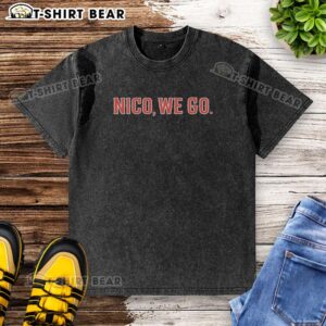 Alt Text: Nico Hoerner wearing a Chicago Cubs baseball washed t-shirt, showcasing team spirit and style on game day.