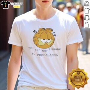 Alt Text: Premium Tabby Cat head graphic on You Are Not Immune To Propaganda T-Shirt, perfect for cat lovers and meme enthusiasts.