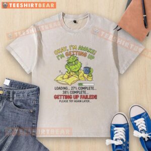 Top Grinch t-shirt design featuring 'Okay I'm Awake, I'm Getting Up' text, perfect for Christmas spirit and holiday fun.