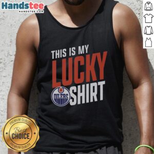 Fan wearing a Hot Edmonton Oilers tank top, showcasing team spirit and luck at a hockey game.