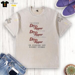 Person in a washed t-shirt holding a can of Dr. Pepper, contemplating taking a sip of their favorite drink.