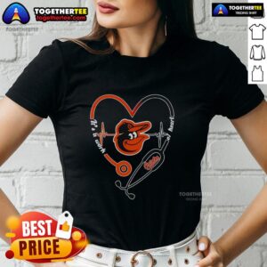 Baltimore Orioles ladies tee featuring a stethoscope and heartbeat design, perfect for fans and healthcare workers.