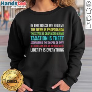 Alt Text: Official 'In This House We Believe' Libertarian Version Sweatshirt showcasing a bold, inspiring statement design.