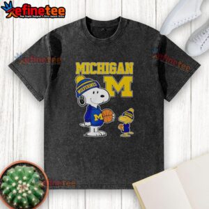 Alt Text: Snoopy and Woodstock in Michigan Wolverines jerseys on a washed t-shirt, showcasing team spirit and classic design.