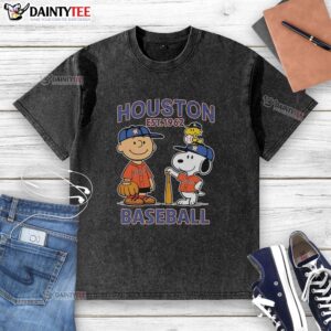 Alt Text: Charlie Brown, Snoopy, and Woodstock wearing a Houston Astros jersey in a vintage washed t-shirt design, Est. 1962.