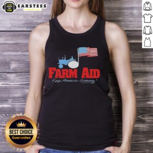 Original Farm Aid Keep America Growing tank top featuring a tractor logo and American flag design.