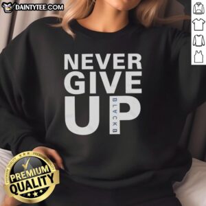 Mohamed Salah wearing a Never Give Up sweatshirt, showcasing his determination and style on and off the field.