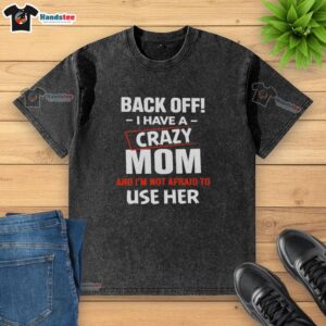 Funny washed t-shirt with 'Back Off I Have A Crazy Mom' humor, perfect for showcasing a playful personality.