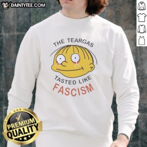 Alt Text: Nice The Teargas Tastes Like Fascism sweatshirt featuring bold text design, perfect for expressing anti-fascist sentiment.