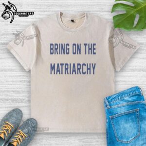 Alt Text: Official 'Bring On The Matriarchy' F1 washed t-shirt showcasing the youngest championship leader at the 2026 Japanese Grand Prix.