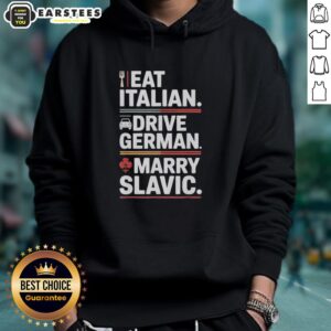 Person wearing 'Awesome Eat Italian Drive German Marry Slavic Balkan Wife' hoodie, standing by a car in Europe.