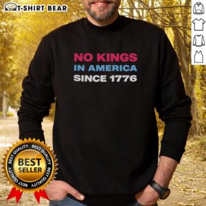 Jamie Lee Curtis wearing a retro sweatshirt featuring 'No Kings in America Since 1776' design, celebrating freedom.