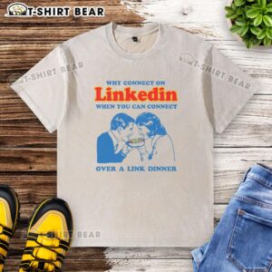 Man in a washed t-shirt enjoying dinner while discussing LinkedIn connections, emphasizing networking beyond the platform.