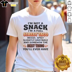 Humorous 'Good I'm Not A Snack I'm A Full Street Taco' T-shirt design showcasing fun taco-themed text for food lovers.